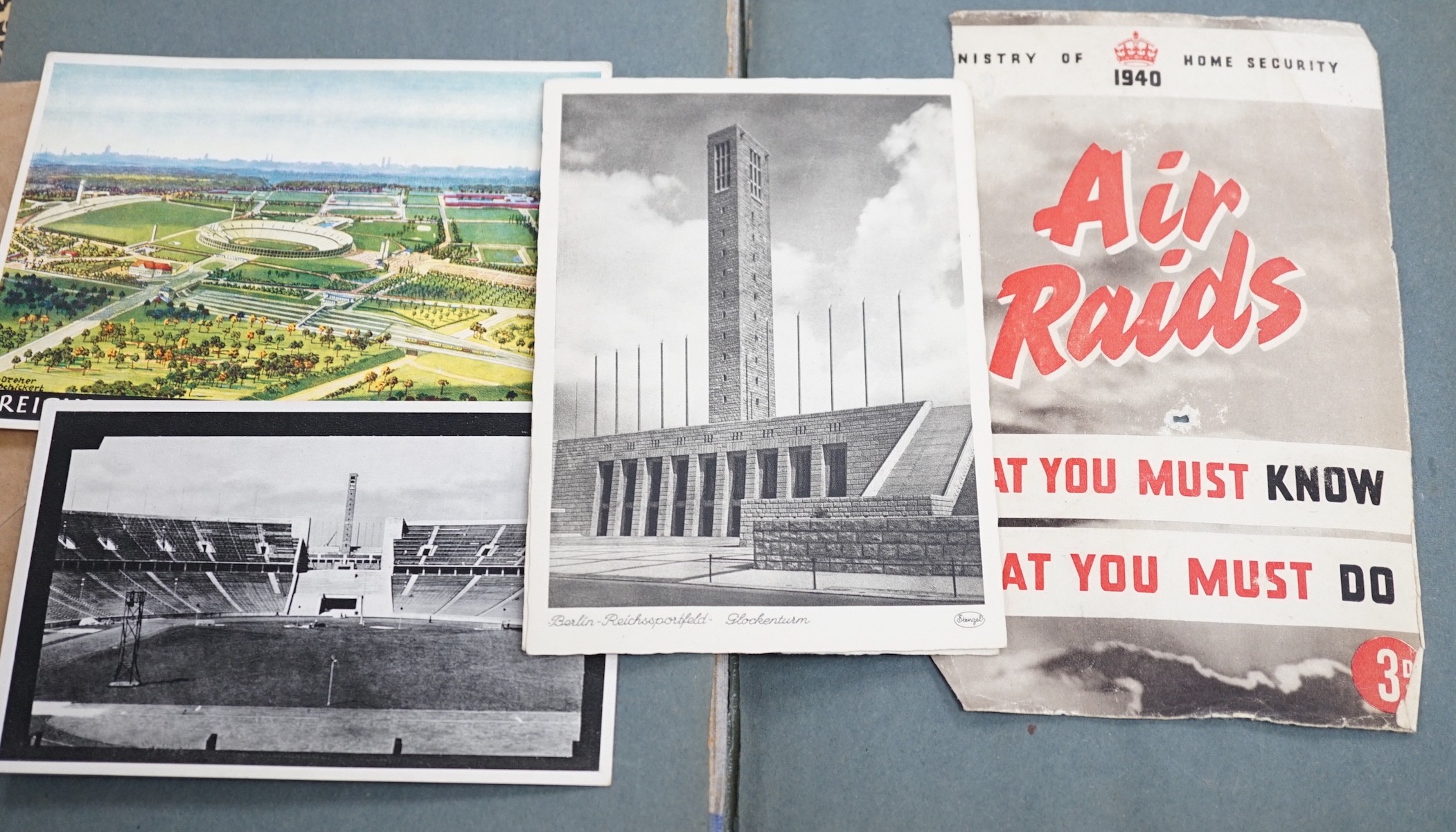 WWII interest album of postcards, printed ephemera and medals relating to Allied expeditionary force, Adolf Hitler headed paper, German medals, Berlin Olympic stadium, banknotes etc.